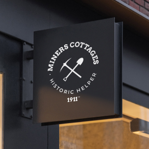 Miners Cottages storefront sign